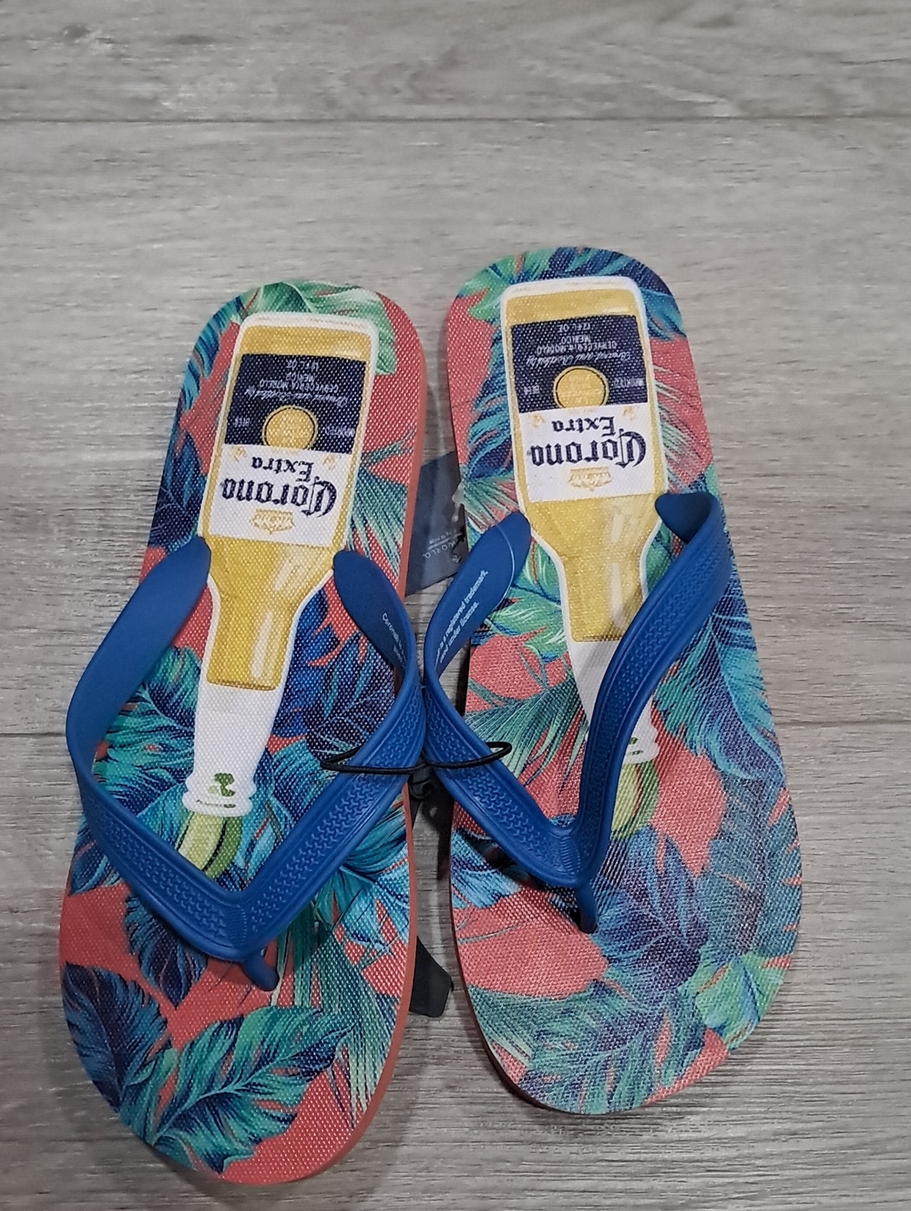Corona Tropical Flip Flops with Blue Straps and Yellow Bottle Graphic